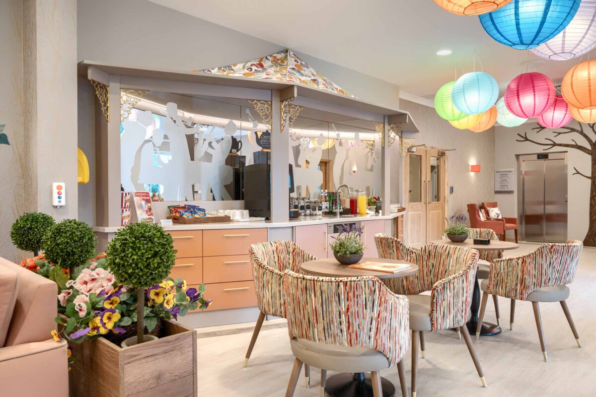 Coffee bar and lounge at a care home. Elevation is a specialist investment manager in the European senior living and healthcare real estate sector.