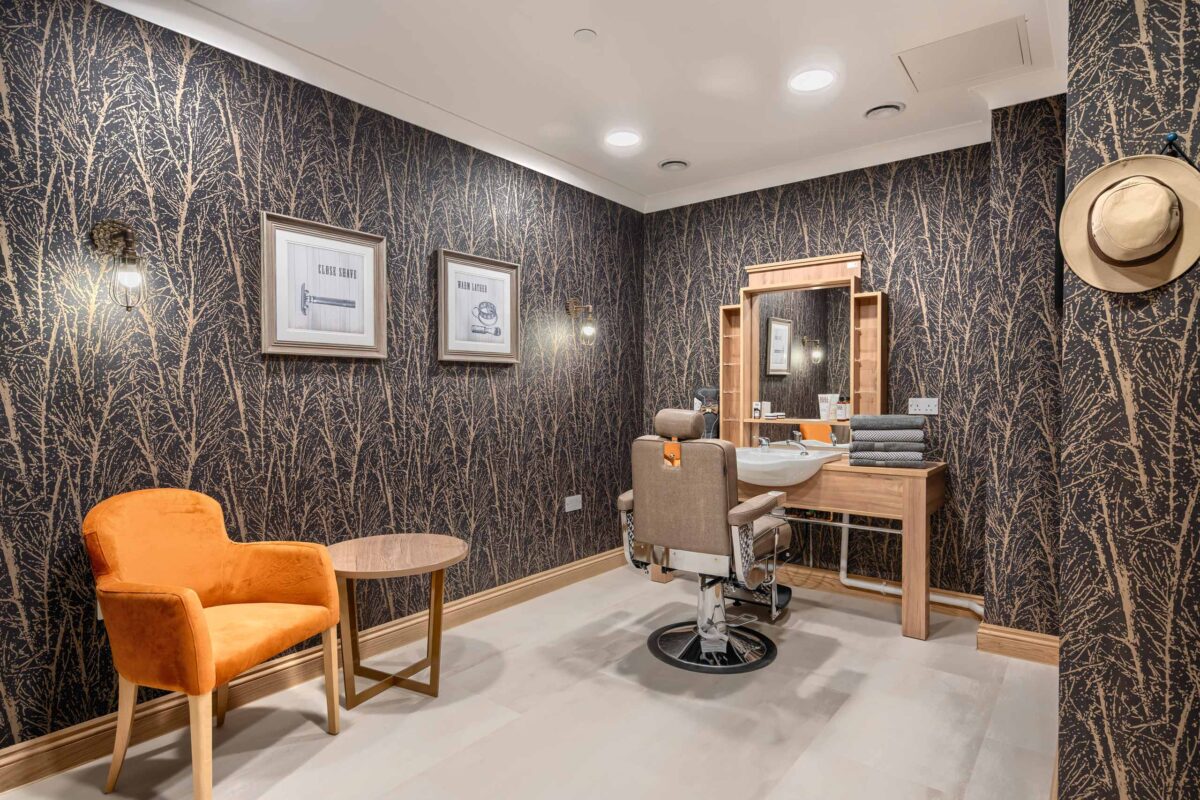 Hairdressers at a care home. Elevation is a specialist investment manager in the European senior living and healthcare real estate sector.