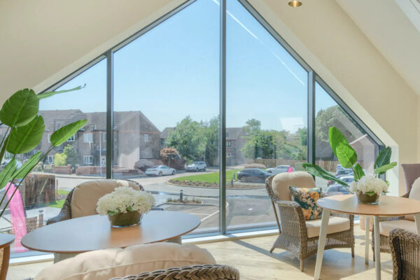 Conservatory lounge in a care home. Elevation is a specialist investment manager in the European senior living and healthcare real estate sector. Elevation provides healthcare real estate lending, leases and development joint ventures.